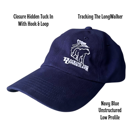 A navy blue colored, low-profile unstructured cap with an embroidered design featuring the mountain lion logo, and text 'TRACKING THE LONGWALKER WITH Brass BUCKLE'. Cap is Unisex and can be worn by adults and children.