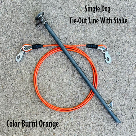 A single dog tie-out line with a stake, featuring a burnt orange colored cable and a metal stake with a spring snap on one end. The image is labeled with the product name and the color of the cable.