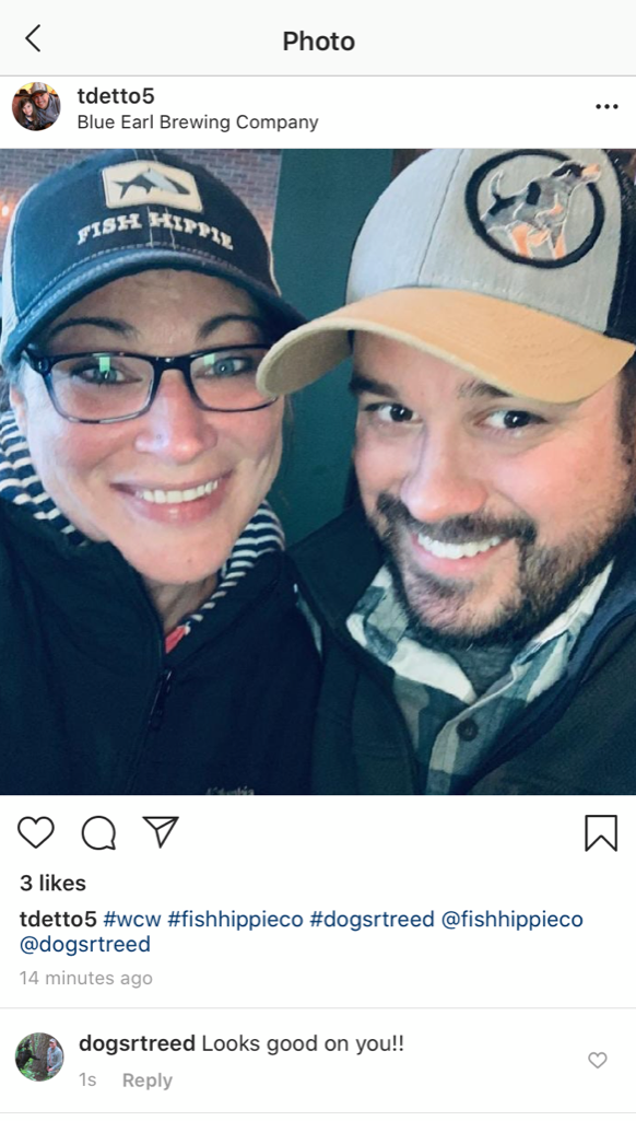 dogsRtreed testimonial photo with a female and a male. Hat shows dogsRtreed logo with a hound dog embroidered. Hat is Light grey, tan and black. 