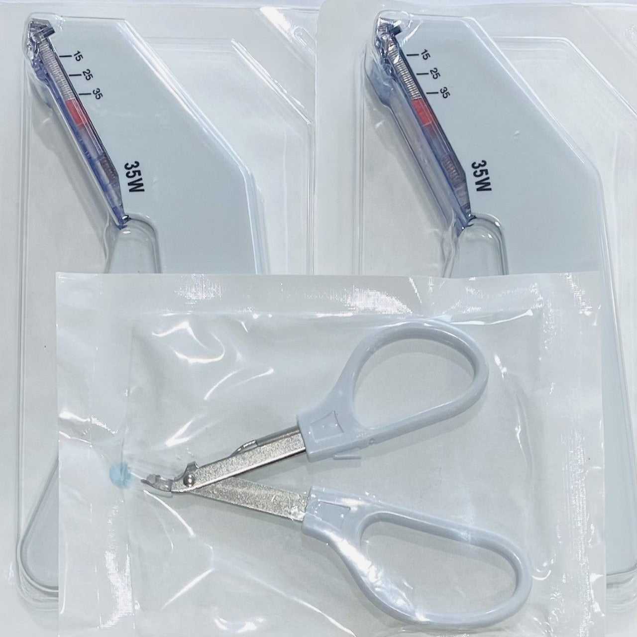 Image shows Qty 2 Skin Staplers and 1 Skin Staple Remover. 